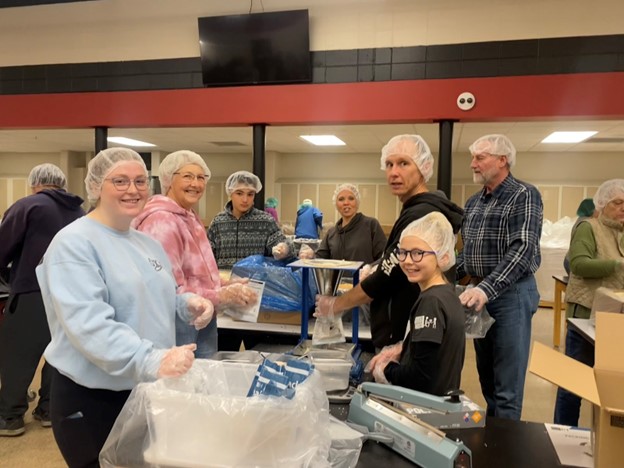 A packing group packed several boxes of meals over the course of the two hour period.