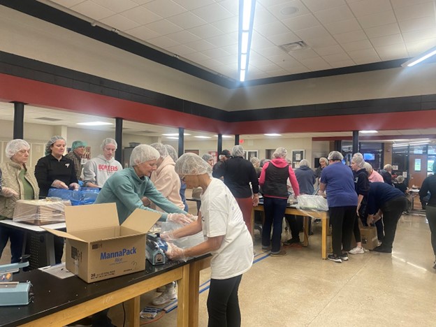 The town of Cannon Falls gathered at CFHS to pack meals.