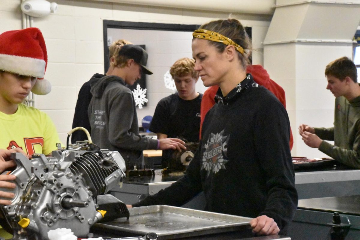 Thoe-Austin teaching her small engines class.