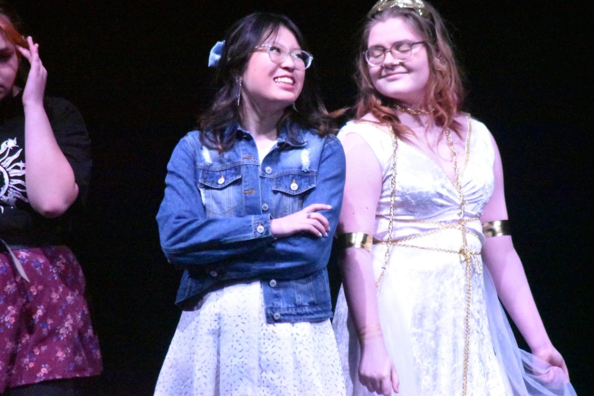 Eleanor (Angel Zheng) conspires with Minerva (Minette Ammerman) and has her write her Great Gatsby paper.