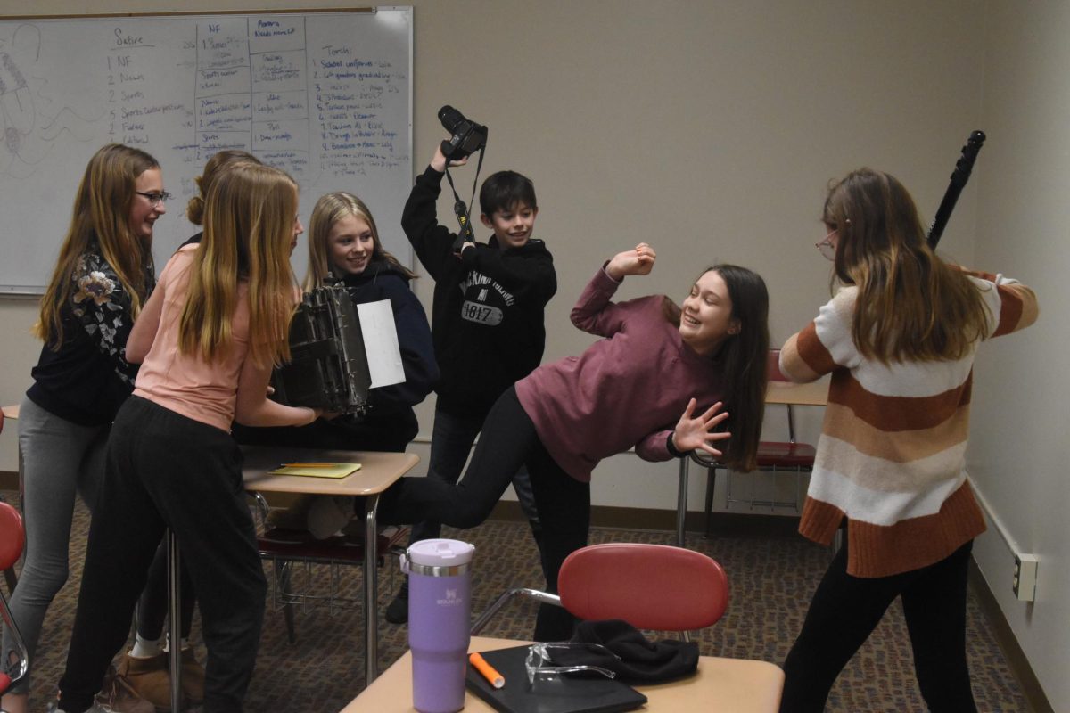 The 6th graders begin to attack the detective.