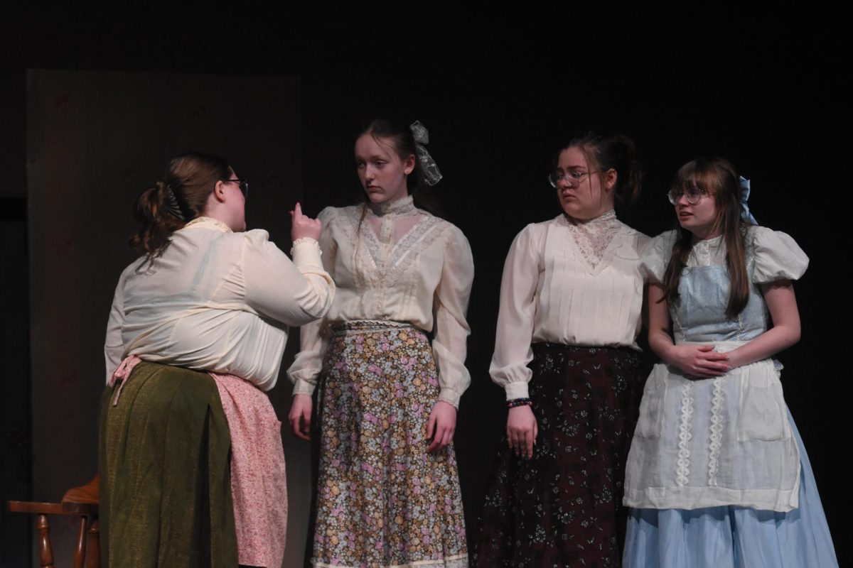 Marilla (Kendahl Zimmerman) reprimands the towns folk for their shaming of Anne.