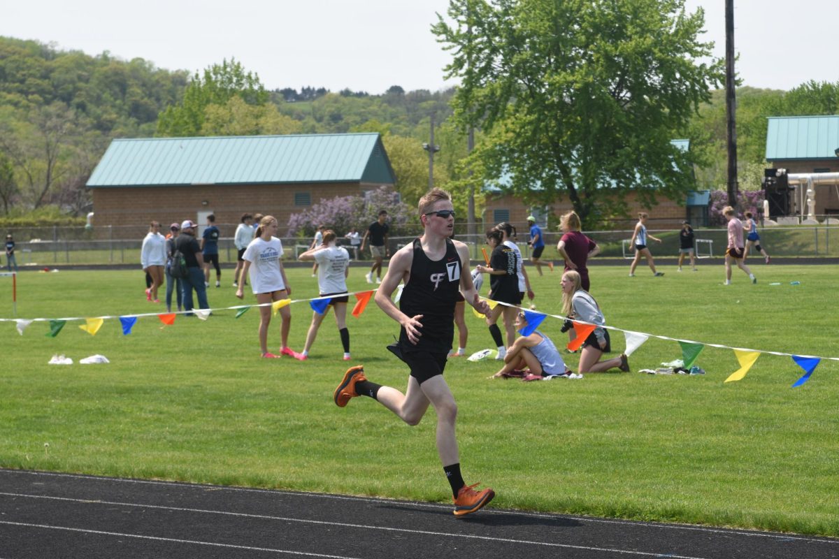 Isaac Anderson sprints to the finish line.