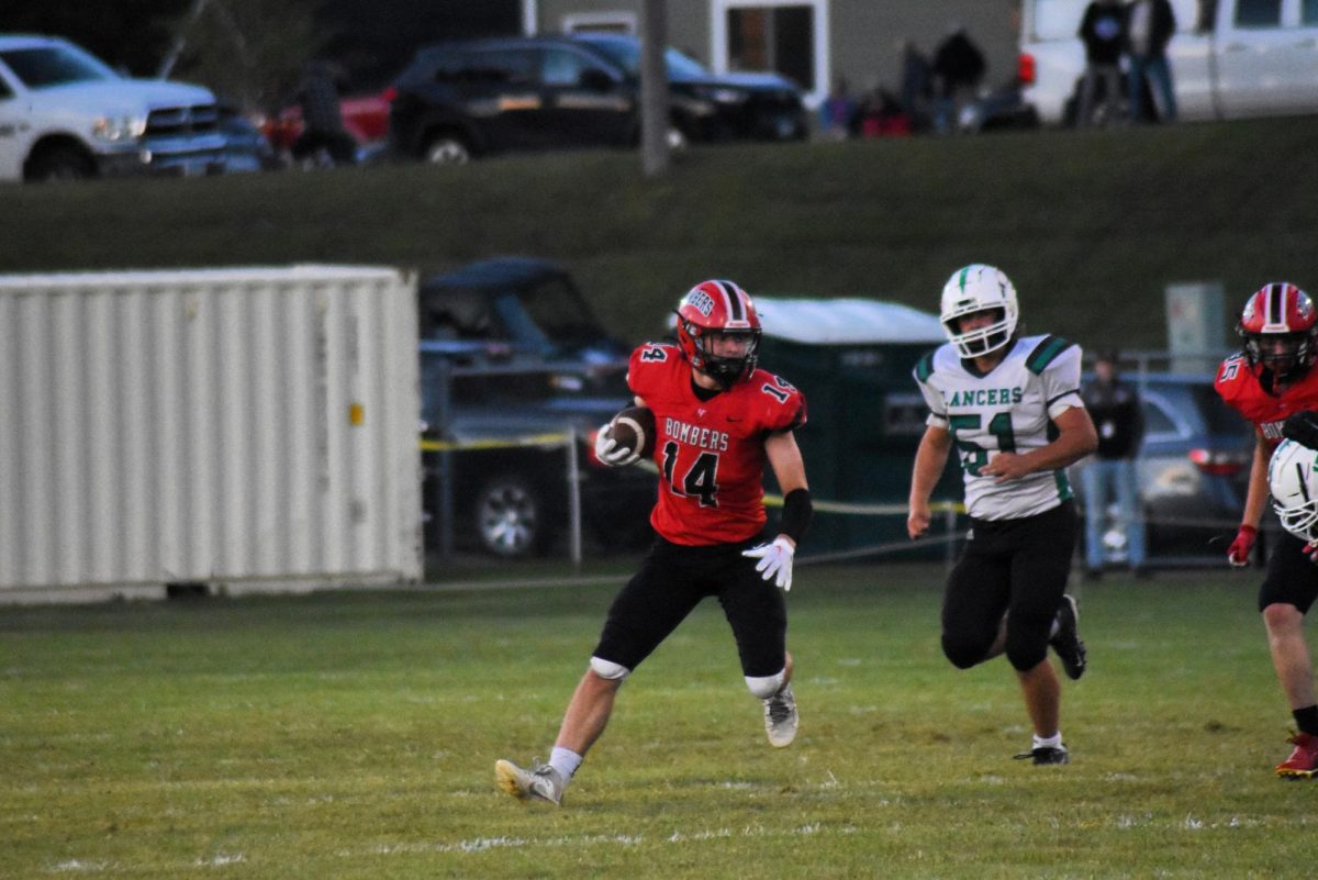 Jack Myers runs down the flied with the ball 