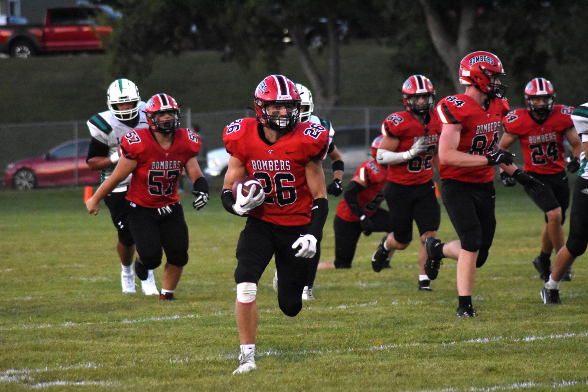 Tysen Lind runs the ball for a good gain of yards  