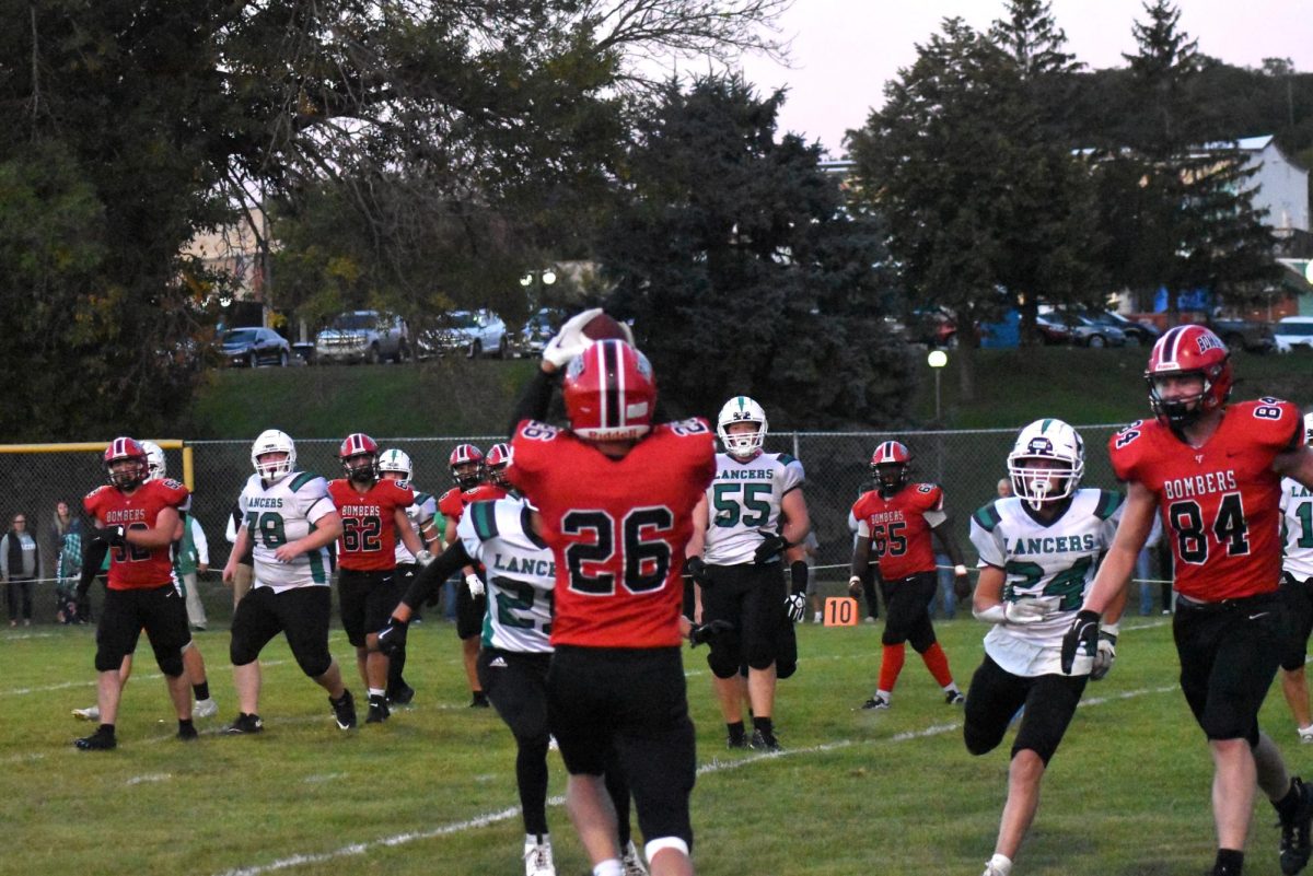 Tysen Lind catches the ball over the defender 