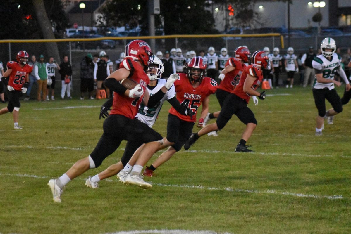 Jack Myers runs the ball up the field 