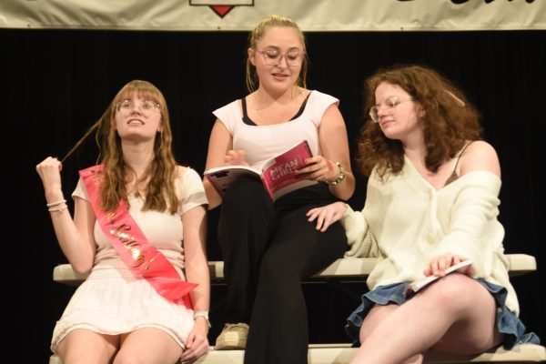 Actresses Aubry Conway, Mackenzie Swanson, and Willow O'Gorman practice being mean for the fall musical, Mean Girls.