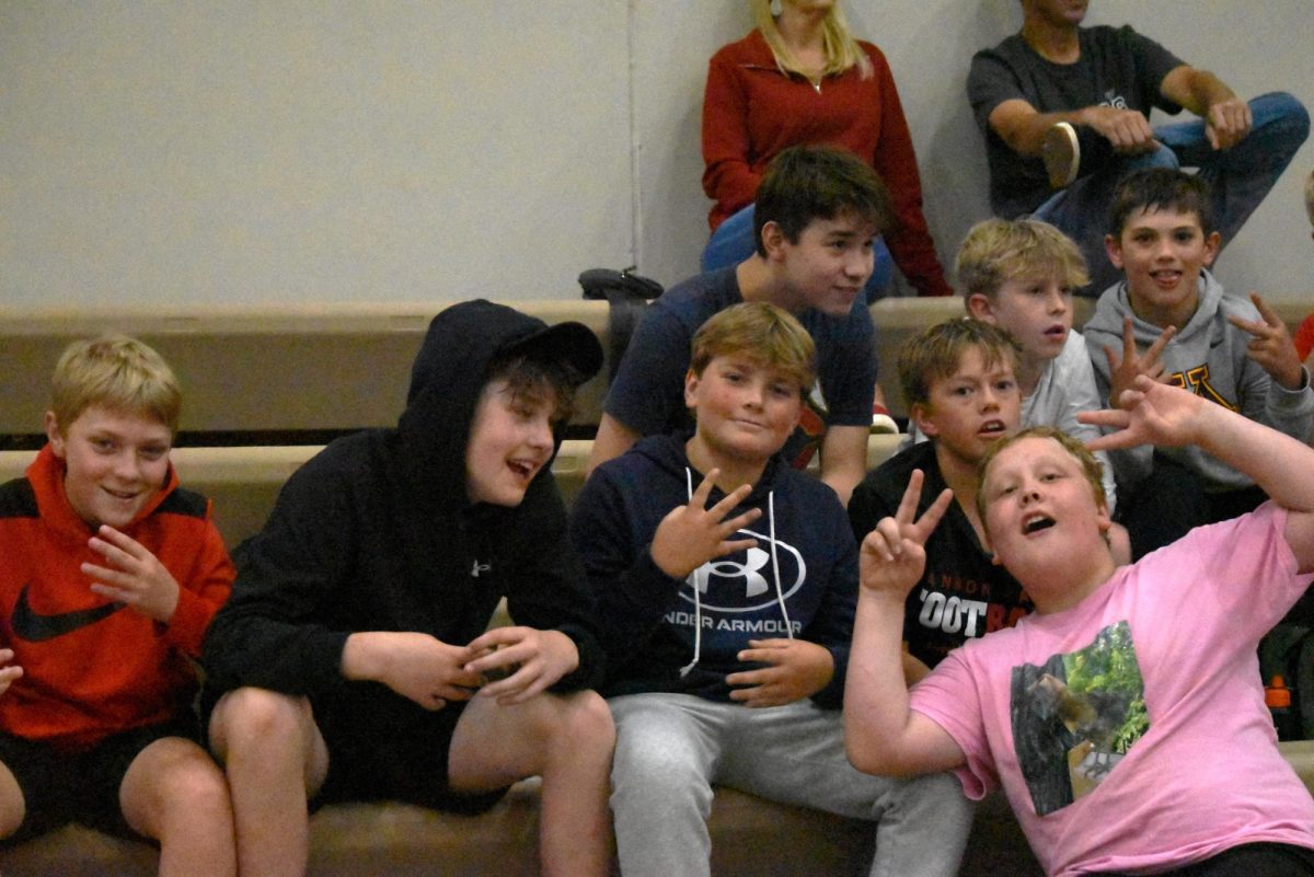 The 7th grade boys come to cheer on the girls with their victory