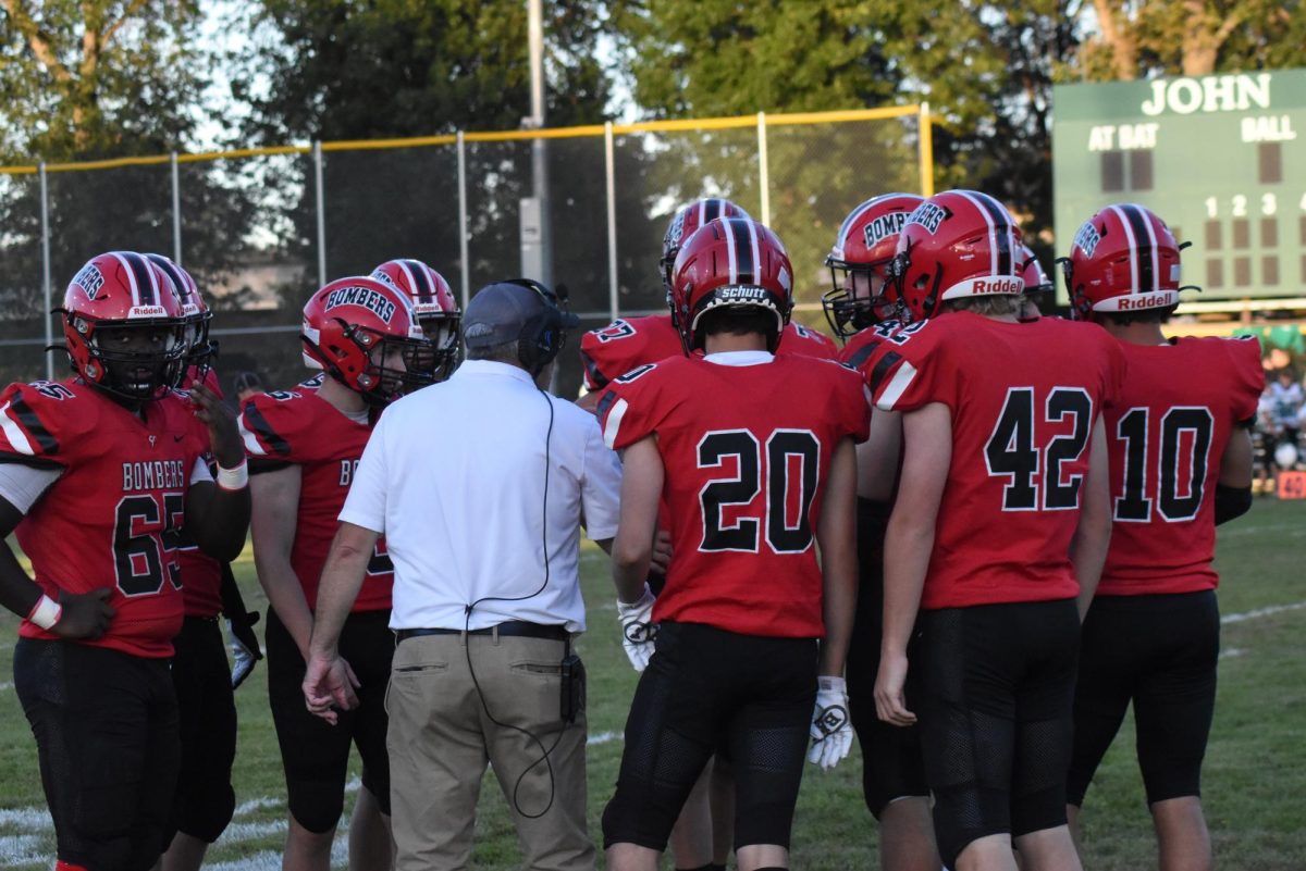 coach Singewald gives his players advice before the game  