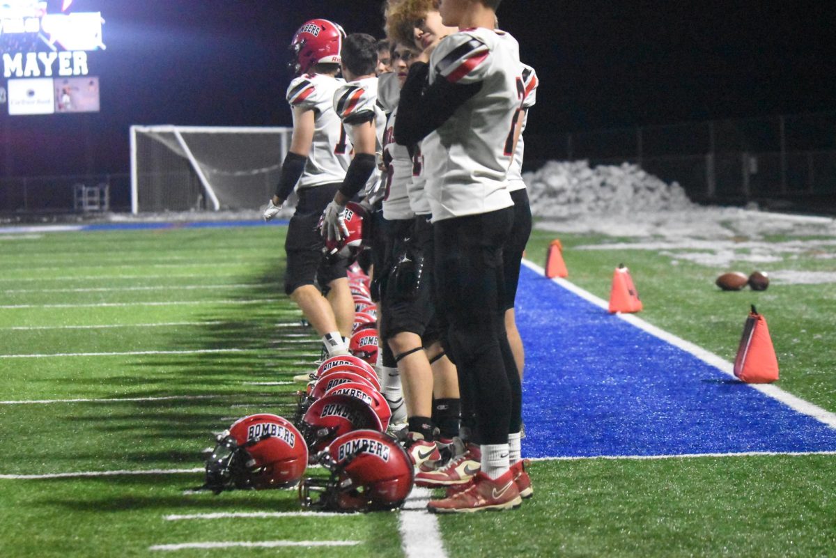 the team listens  to the national anthem before the game