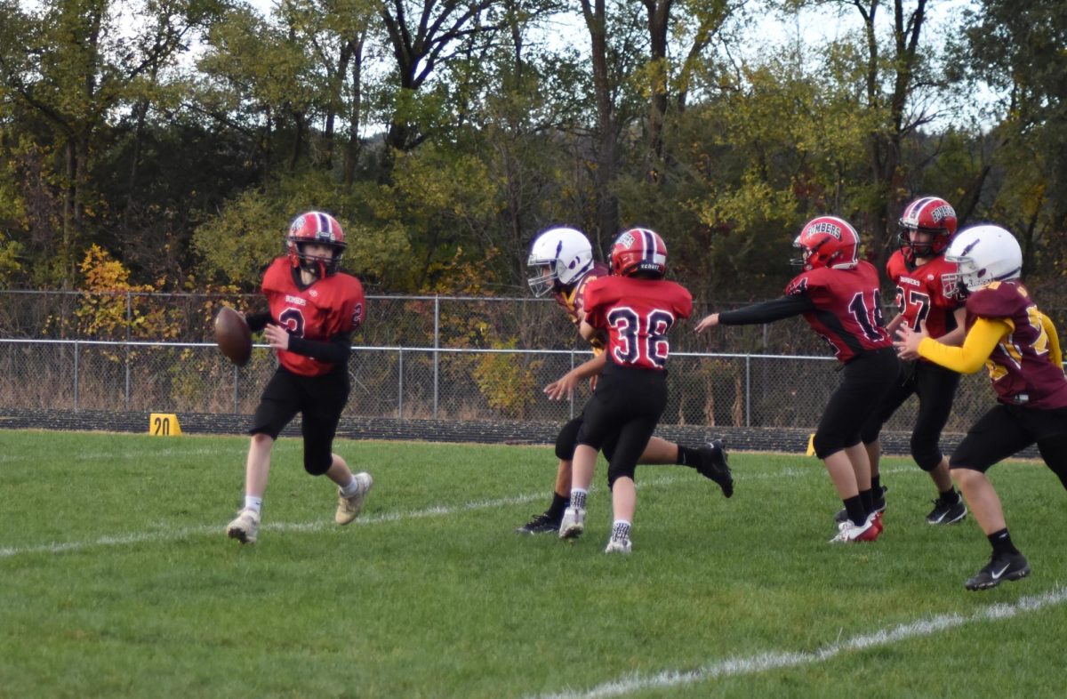 Kolton Miller prepares to pass the ball to one of his teammates