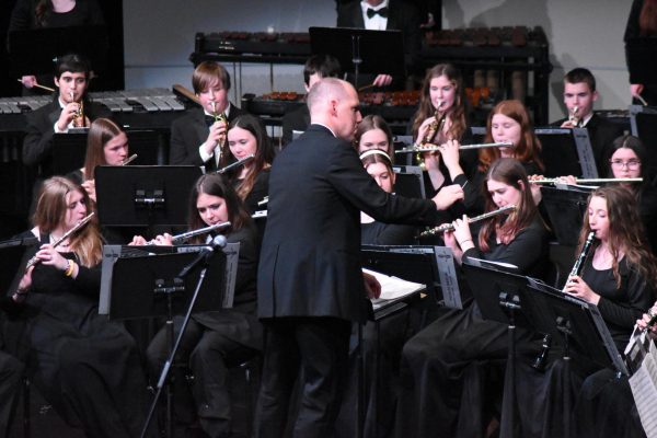 Mr Mike Legvold directs the band during the concert 