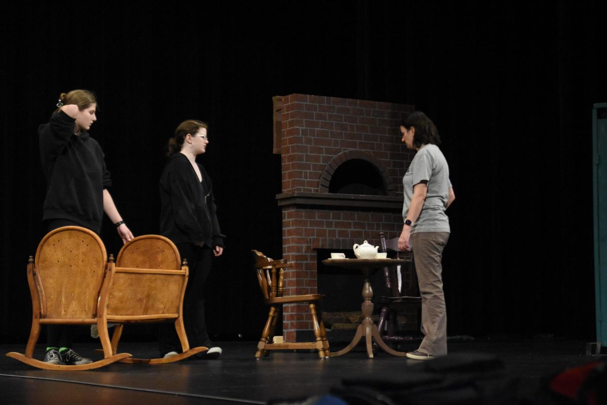 Director Annie Pederson gives directions to cast members Willow O'Gorman and Adelaide Anderson.