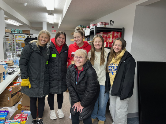 A group of MHS students along with their advisor, Mrs. Hoffman, after collecting the donated food