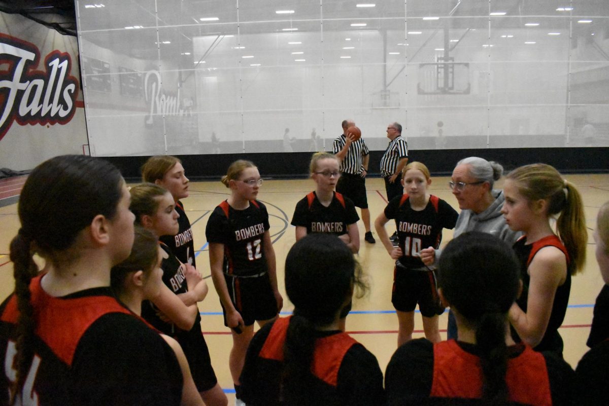 Girls talk strategy during time out 