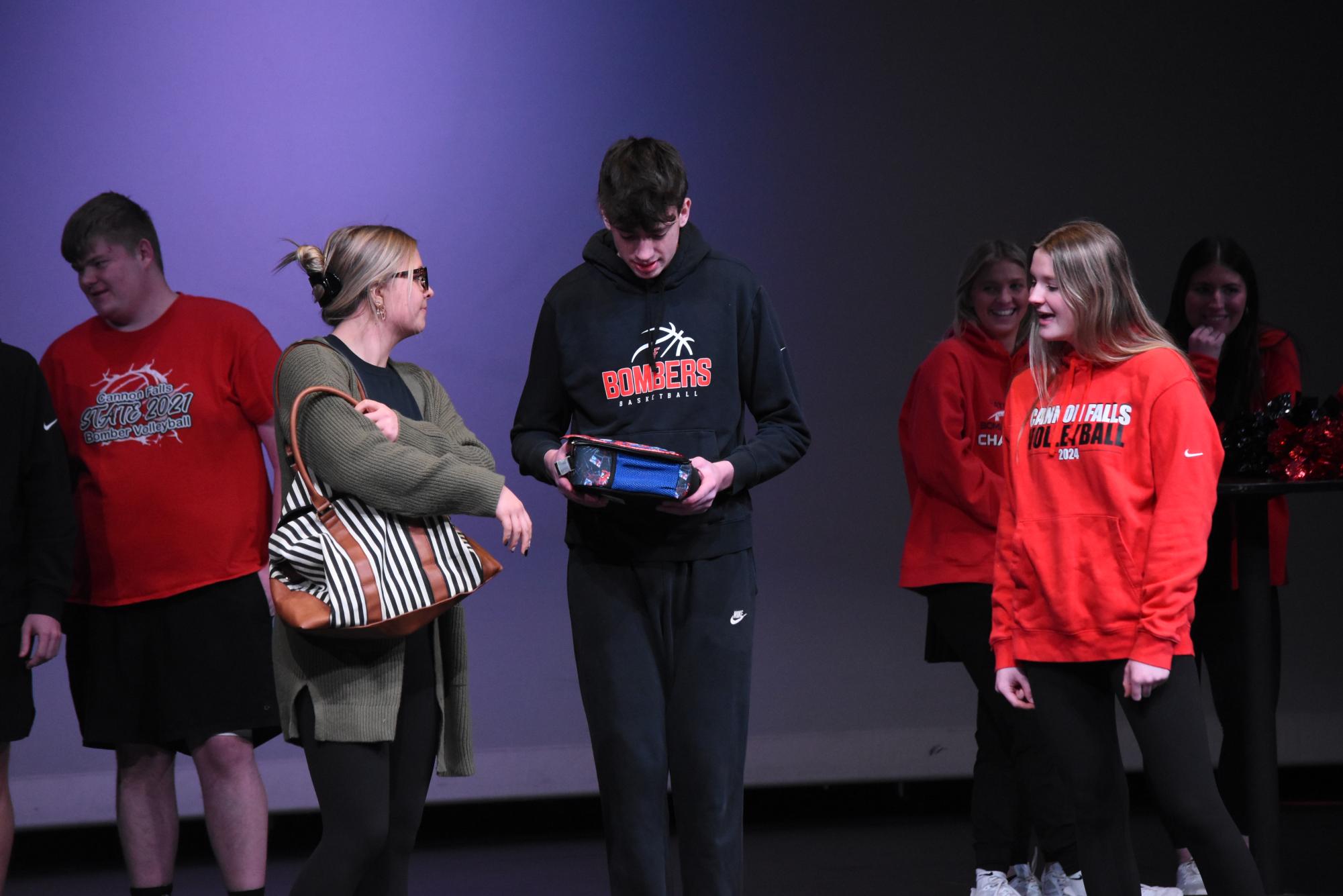  During the play, Sophie is giving Gavin his lunchbox that he forgot