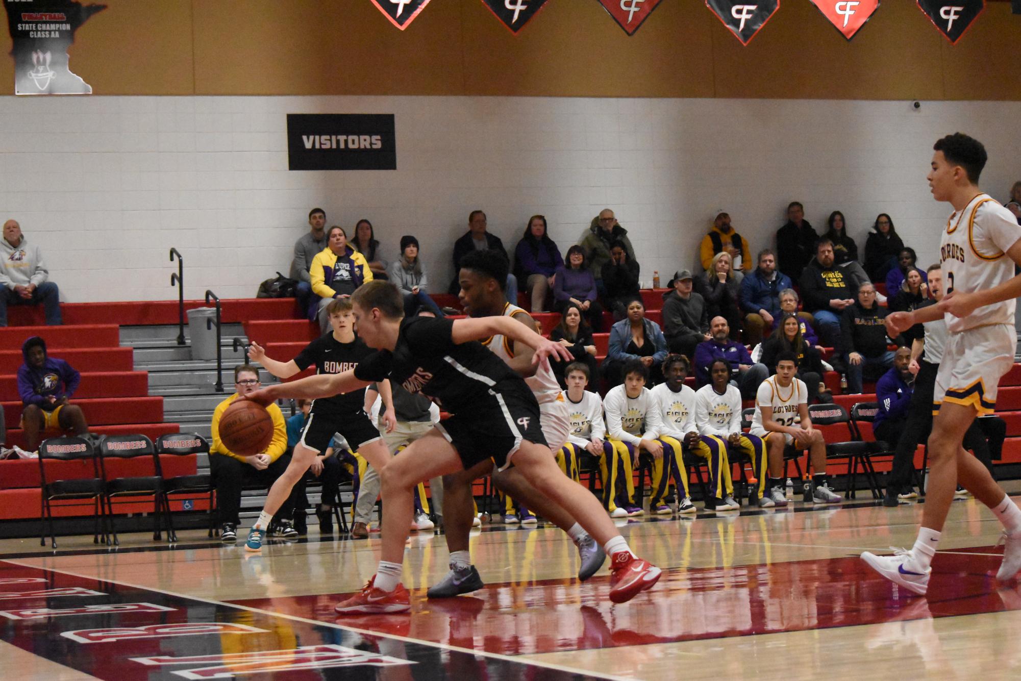 Miles Rechtzigel takes the ball away from Loudes player