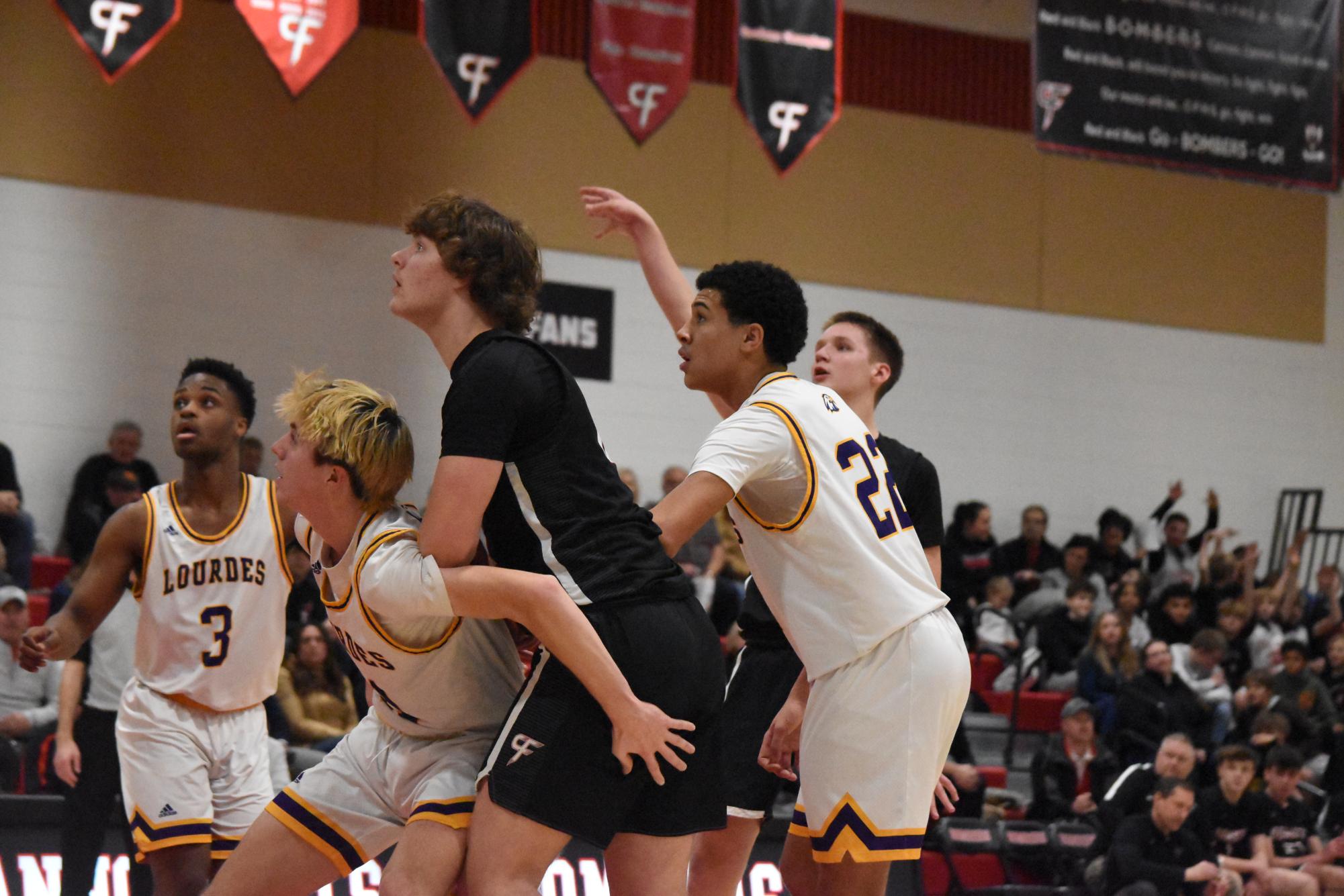 Miles Rechtzigel shoots a free throw against Lourdes