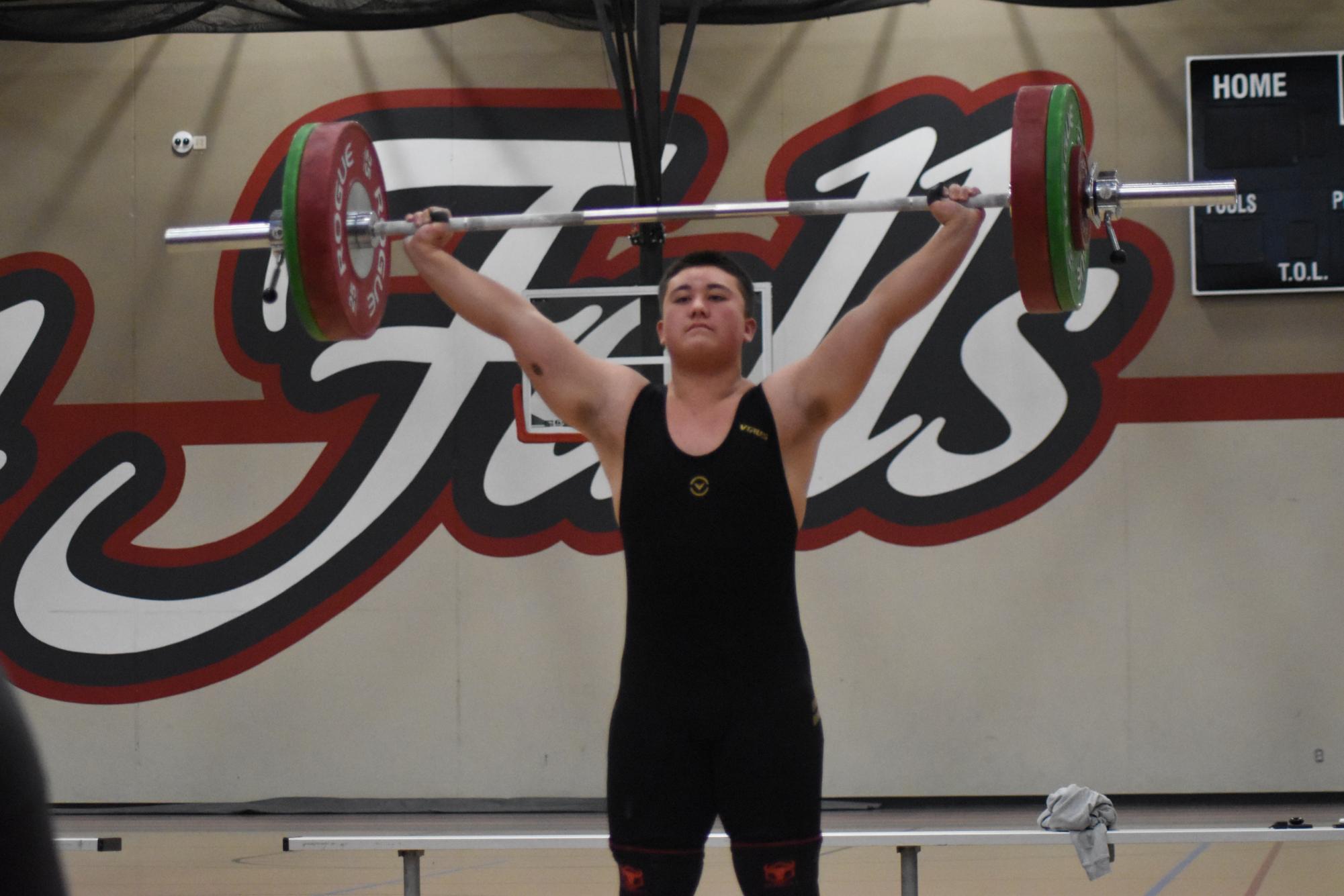 Weightlifter James Huseth successfully completes a clean and jerk.