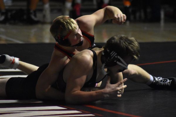 Wrestler Griffin Peterson pins his opponent.