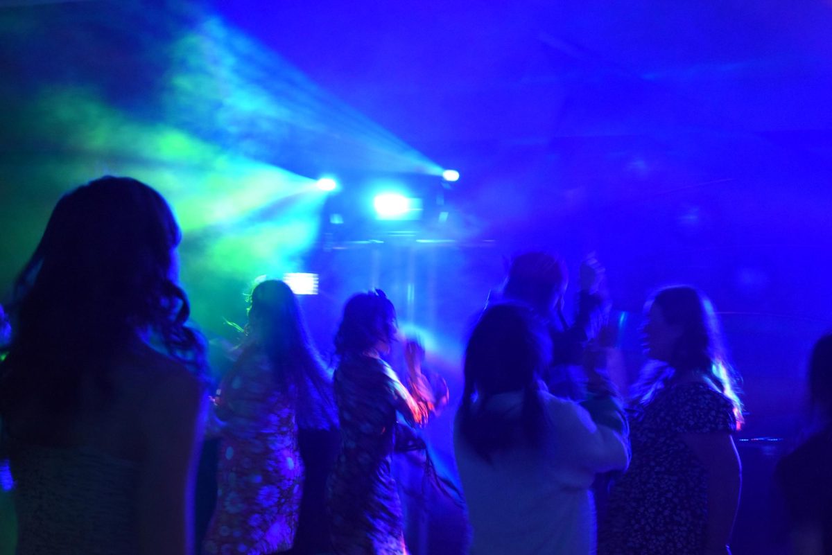 people enjoying themselves on the dance floor