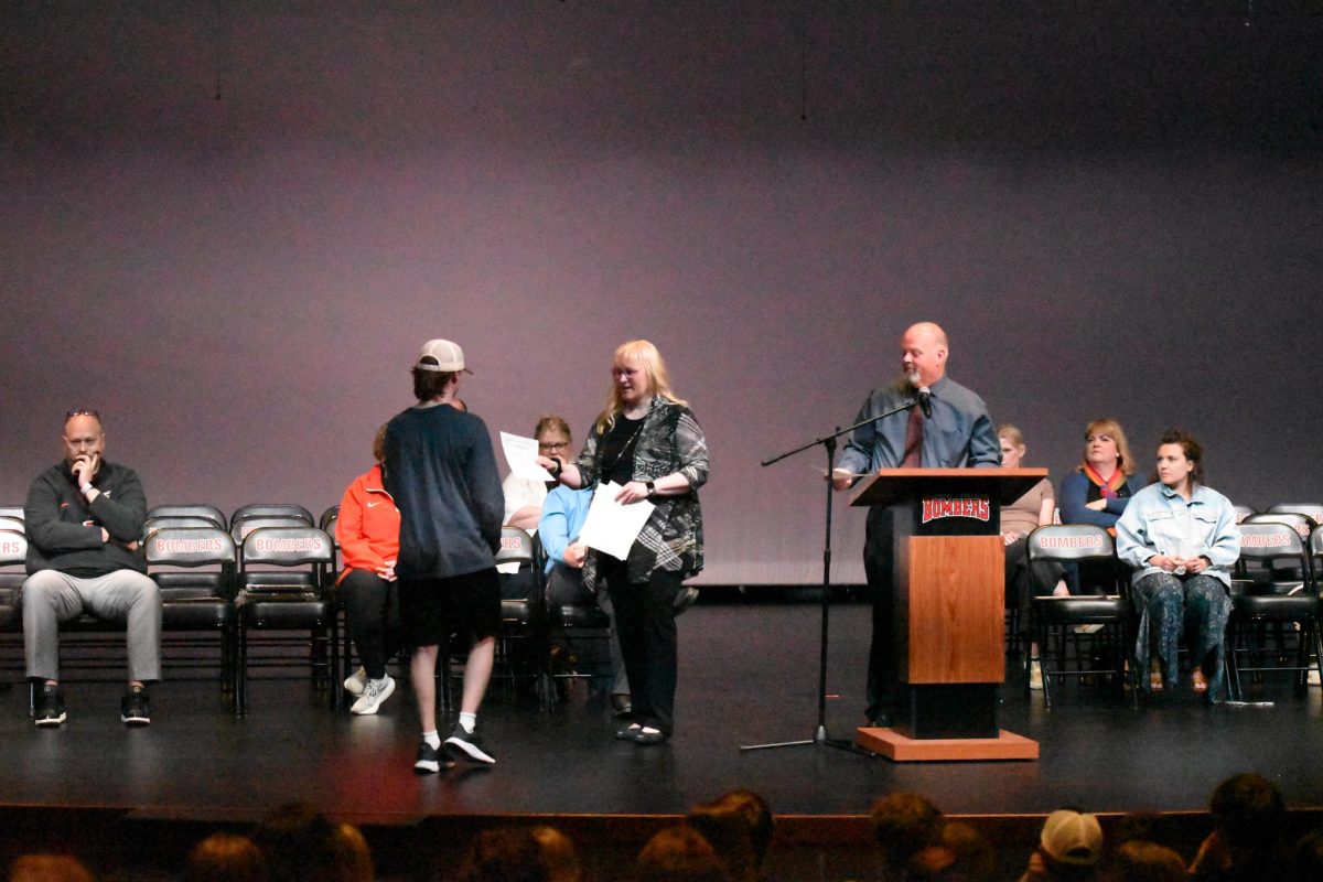 Ms. Hoffman presents junior academic letter awards.