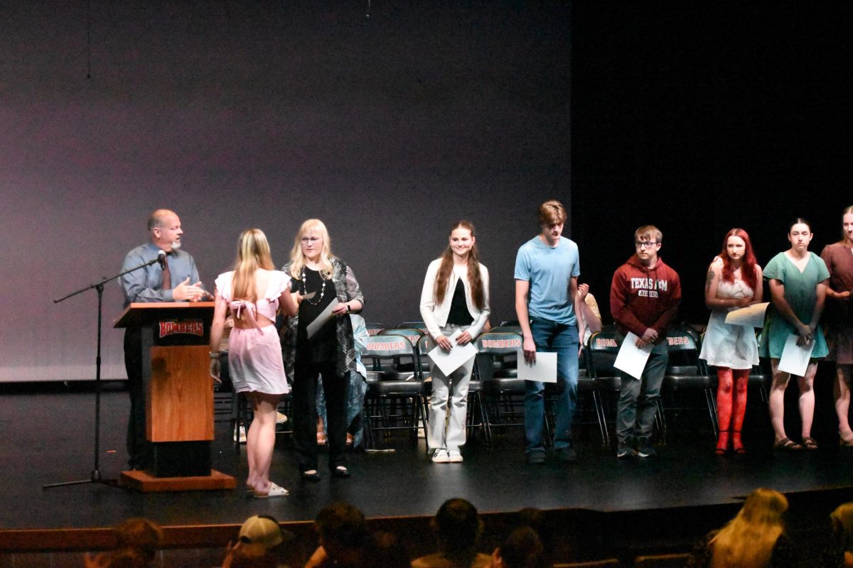 Ms. Hoffman presents senior academic letter awards.