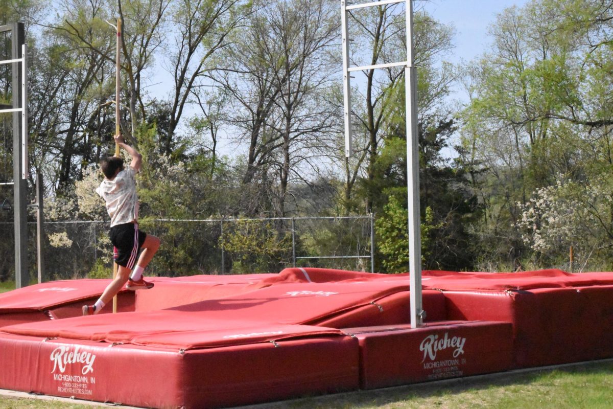 6th grader Cooper-Jack Newman attempts to pole vault.