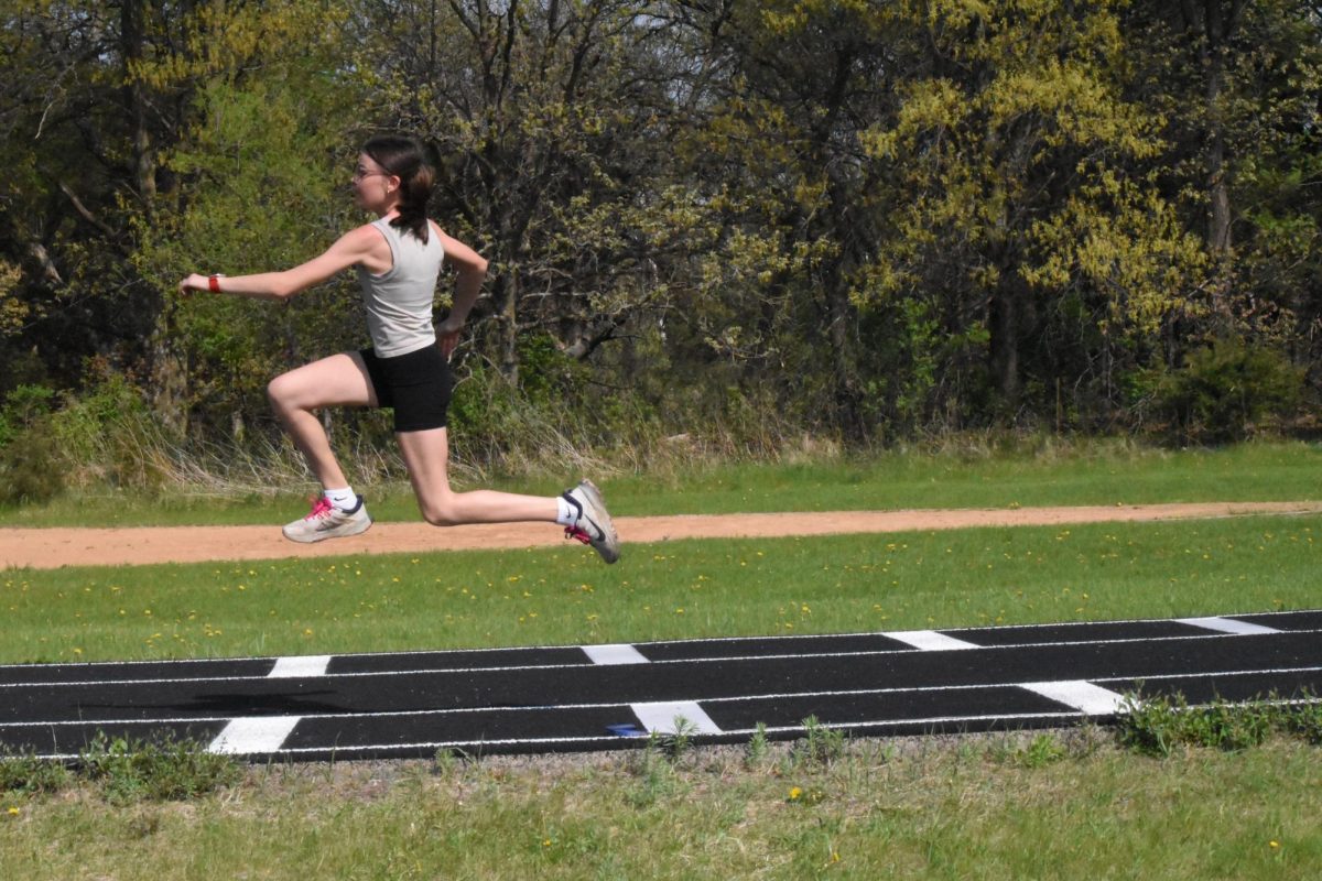 Kinley Sheller jumps up for her first phase of triple jump.
