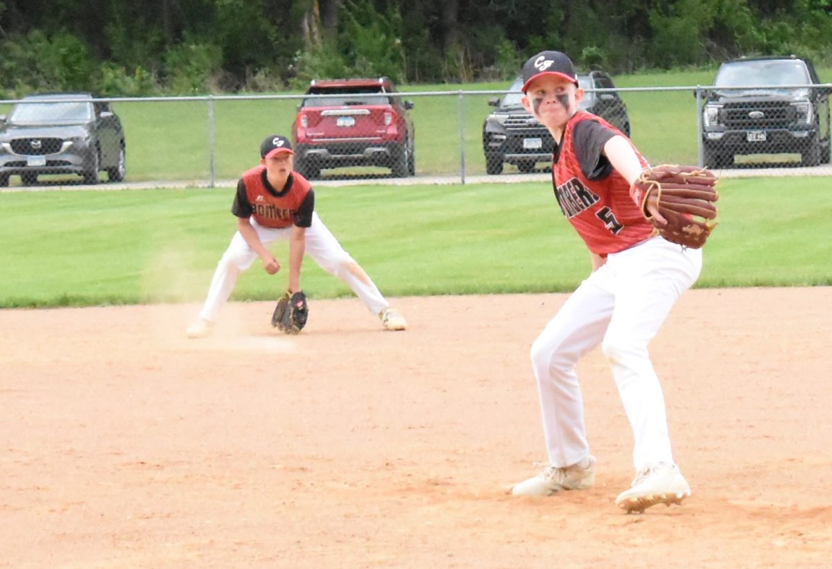 Kolton Miller winds up on his pitch to the plate.