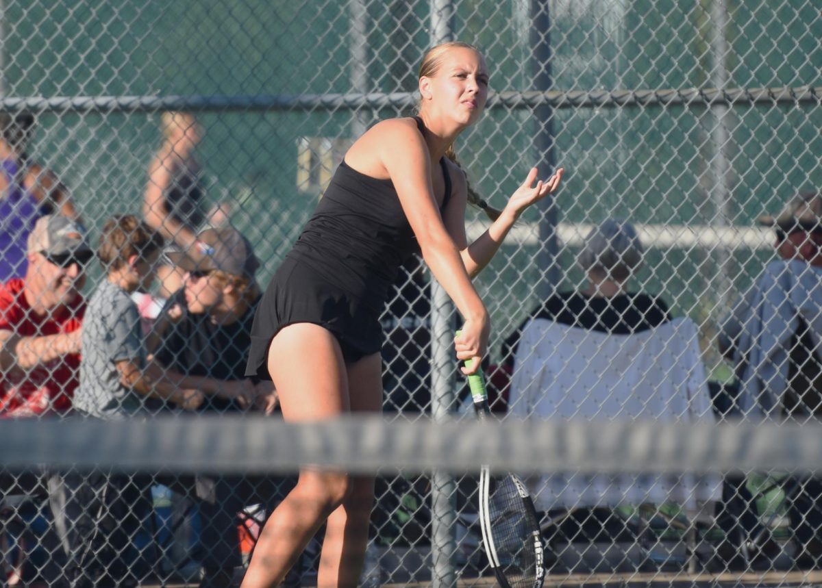 Livia Tennessen follows through on her serve.