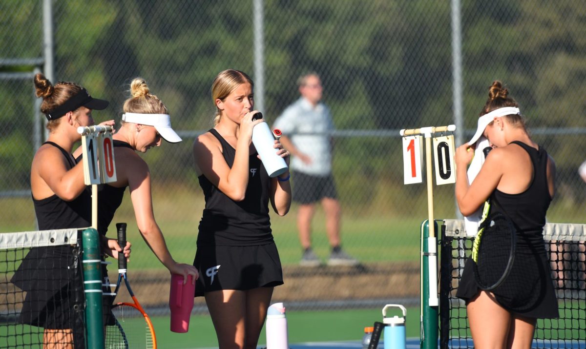 Josie Sjoquist, Sophia Nerison, Cameron Anderson, and Abby Roepke take a water break.