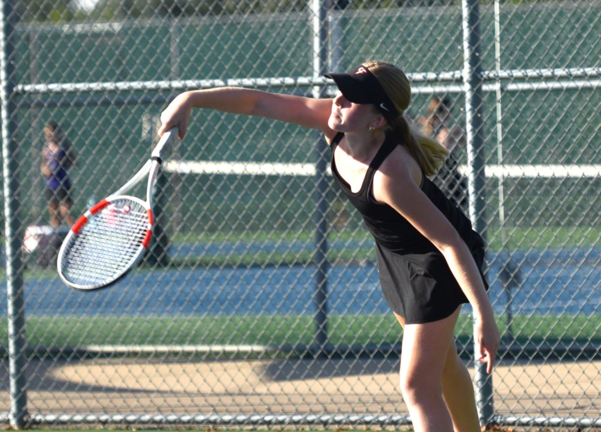 Marissa Mandelkow follows through on a serve.