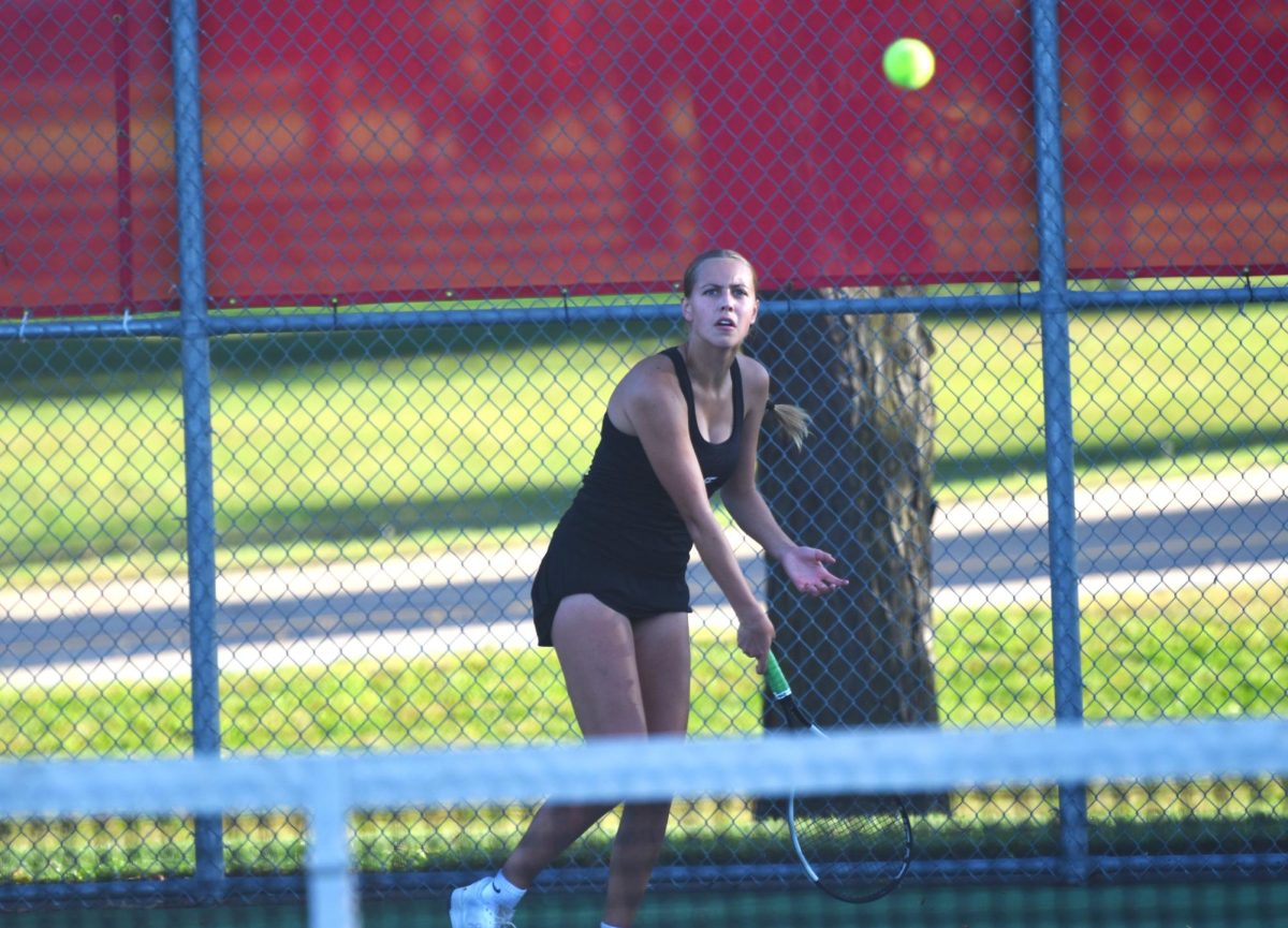 Livia Tennessen follows through on a forehand hit.