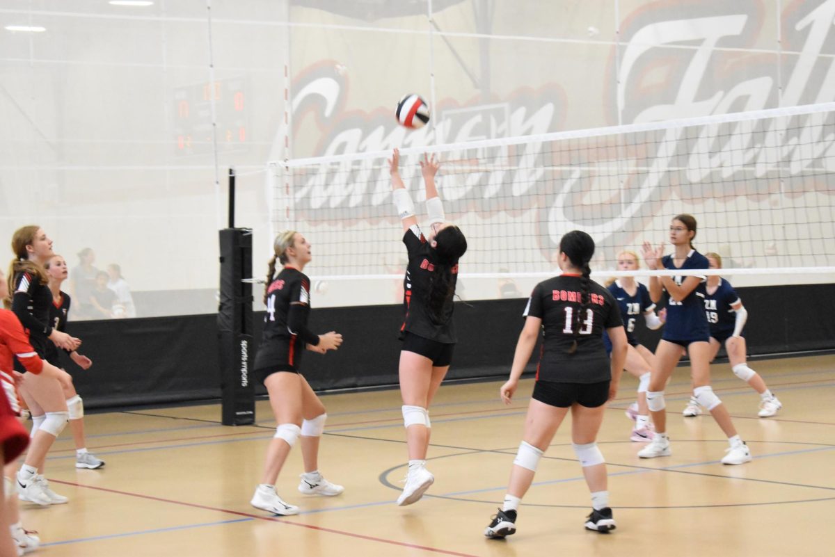 Priscilla Robinson sets the ball to the middle of the court.