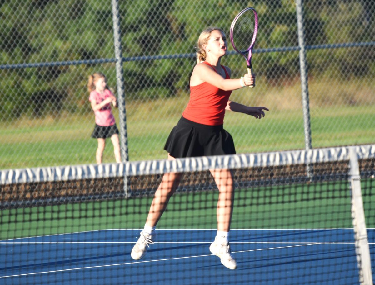 Addison Fox hits a powerful volley.