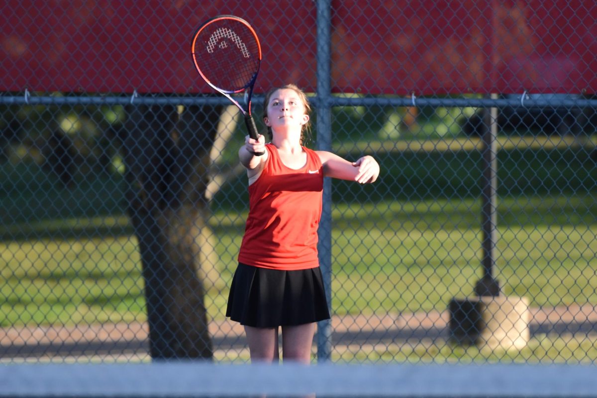 Zoey Stiff punches a volley.