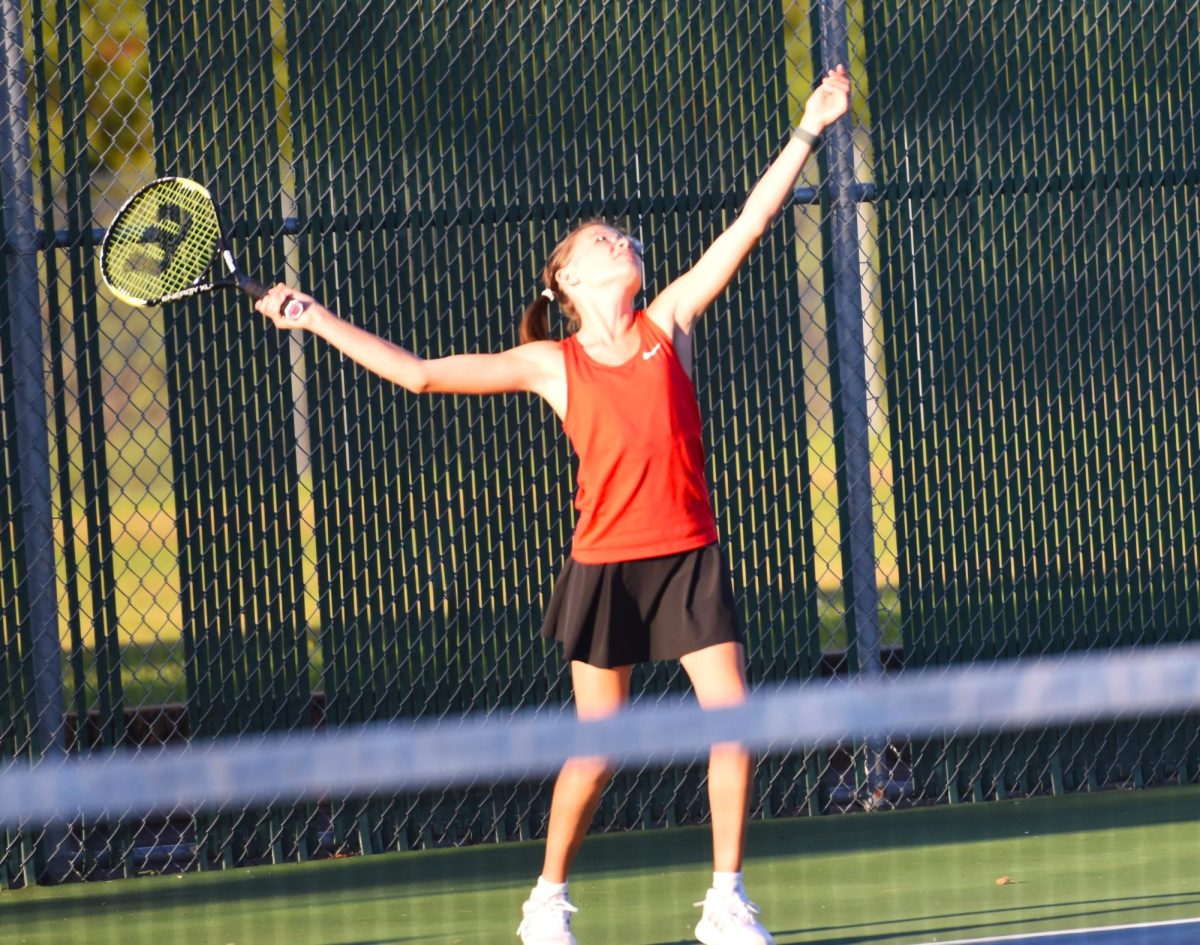Kinley Sheller uses good form to serve the ball.
