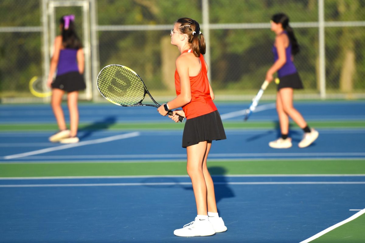 Kinley Sheller waits in good ready position, waiting to return a serve.