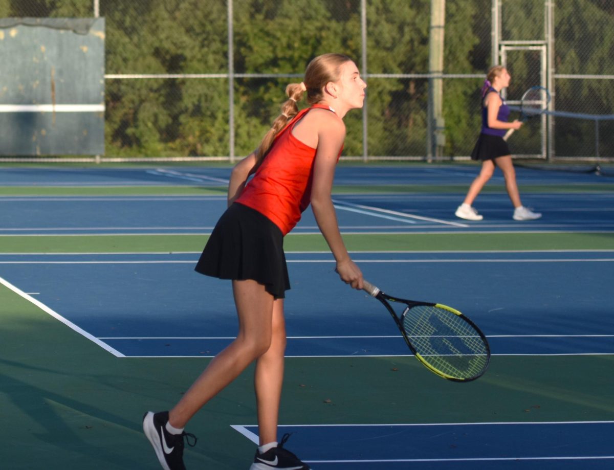 Lola WInchell waits to receive a serve