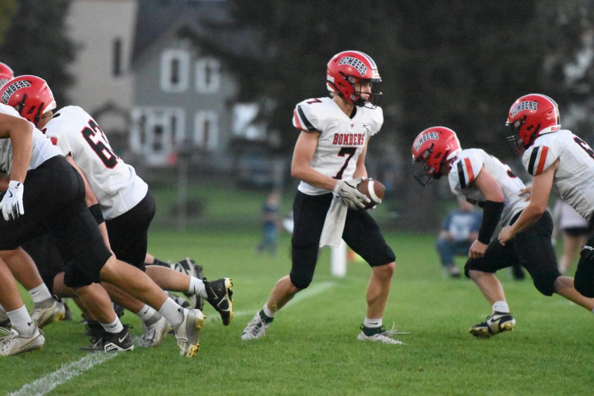Beck Swanson hands the ball off 