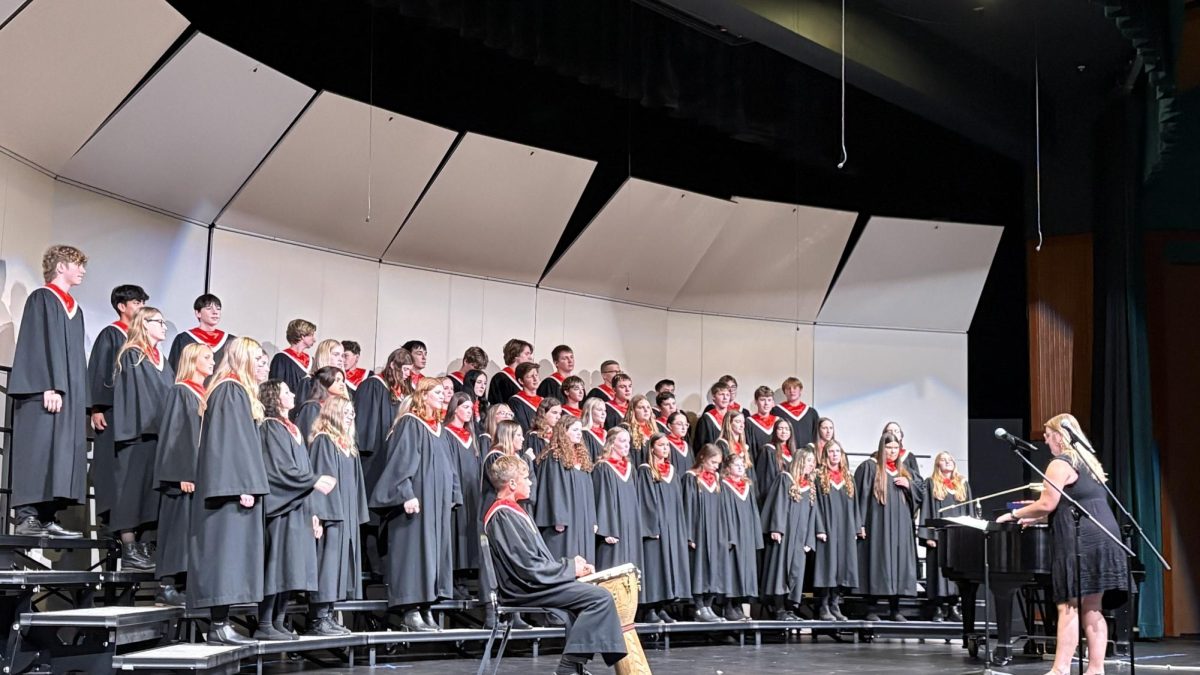 The high school choir prepares to deliver their performance on October 20.