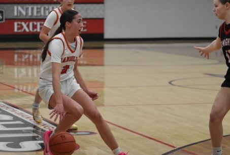 Blake Johnson brings the ball up the court for her team.