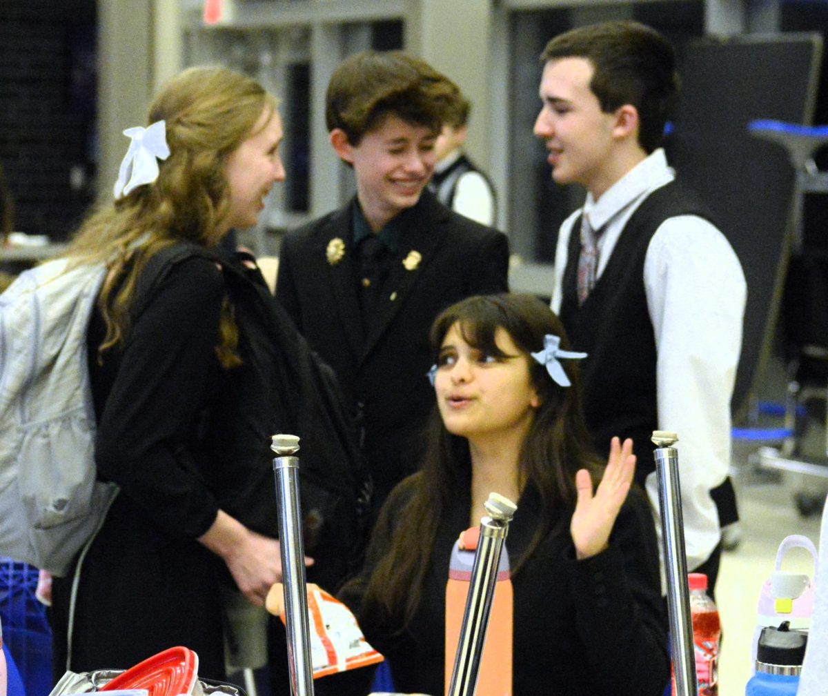 Team members discuss their situation at the HVL tournament on March  9.