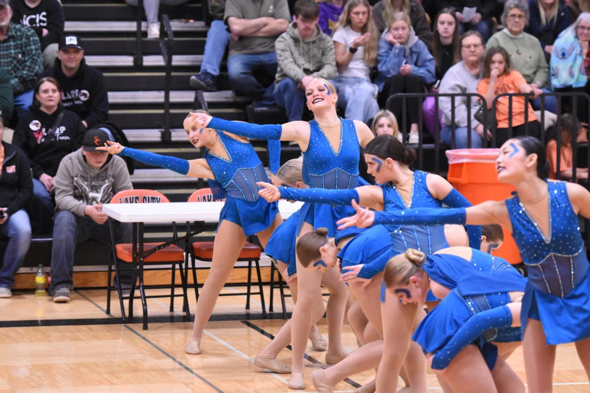 CFHS Dance team performs one of their dances at sections in front of a large audience