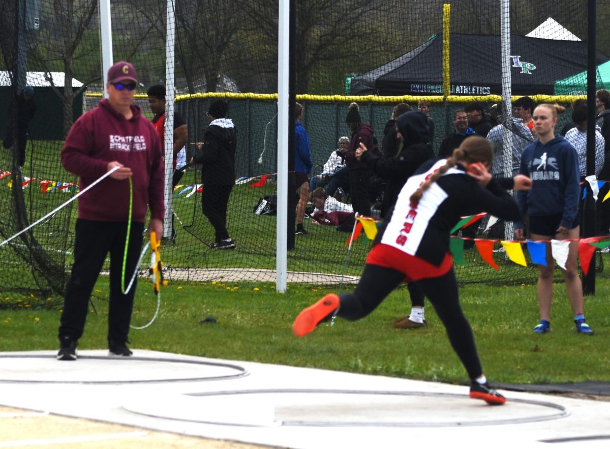 Alyssa Burgess winds up before her shotput performance at the True Team meet on May 5.