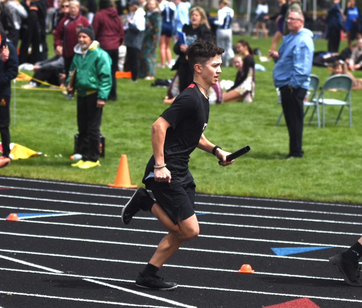 Dylan Geiger during the boys' 4x800 relay race at the True Team meet on May 5.