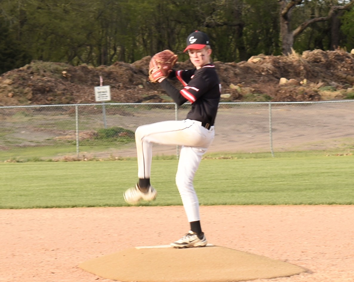 Kolton Miller pitches the ball.